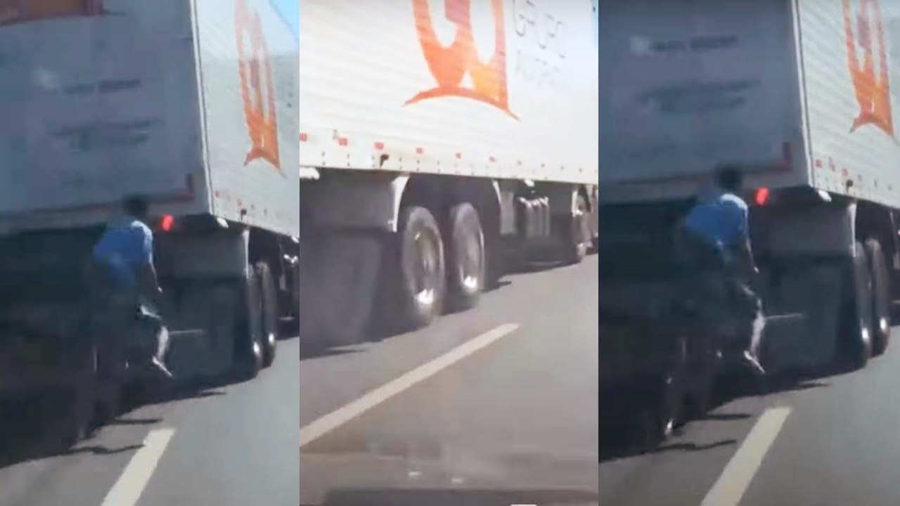 Jovens pegando rabeira em caminhão são surpreendidos com quebra de asa de motorista