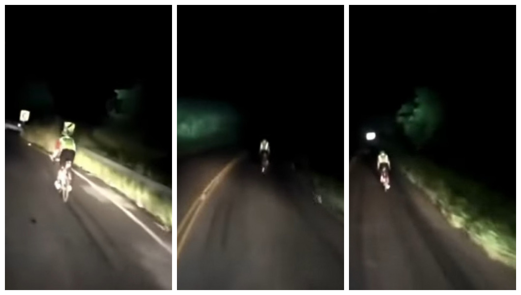Caminhoneiro escolta ciclista iluminando estrada para ciclista 